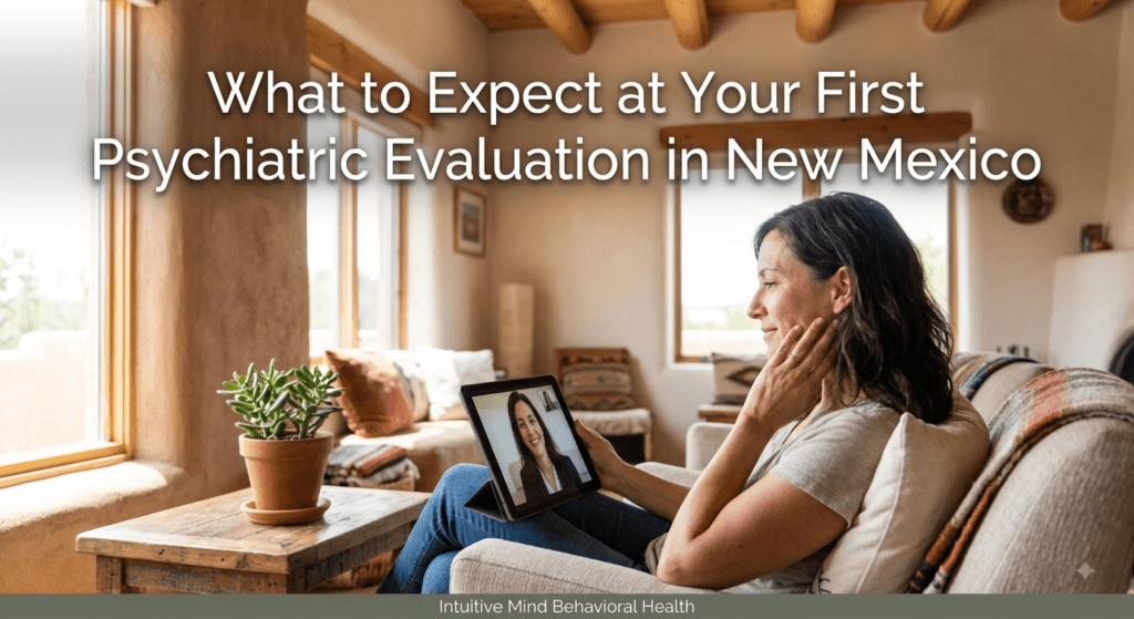 An adult sitting comfortably in a brightly lit Southwestern living room, using a tablet for a virtual telepsychiatry consultation. Overlay text reads "What to Expect at Your First Psychiatric Evaluation in New Mexico."